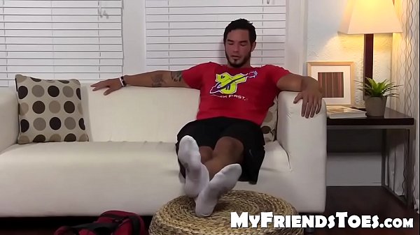 Cute brunette dude RJ shows off his sexy feet for you