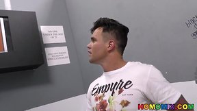 Ebony men interacting at a gloryhole